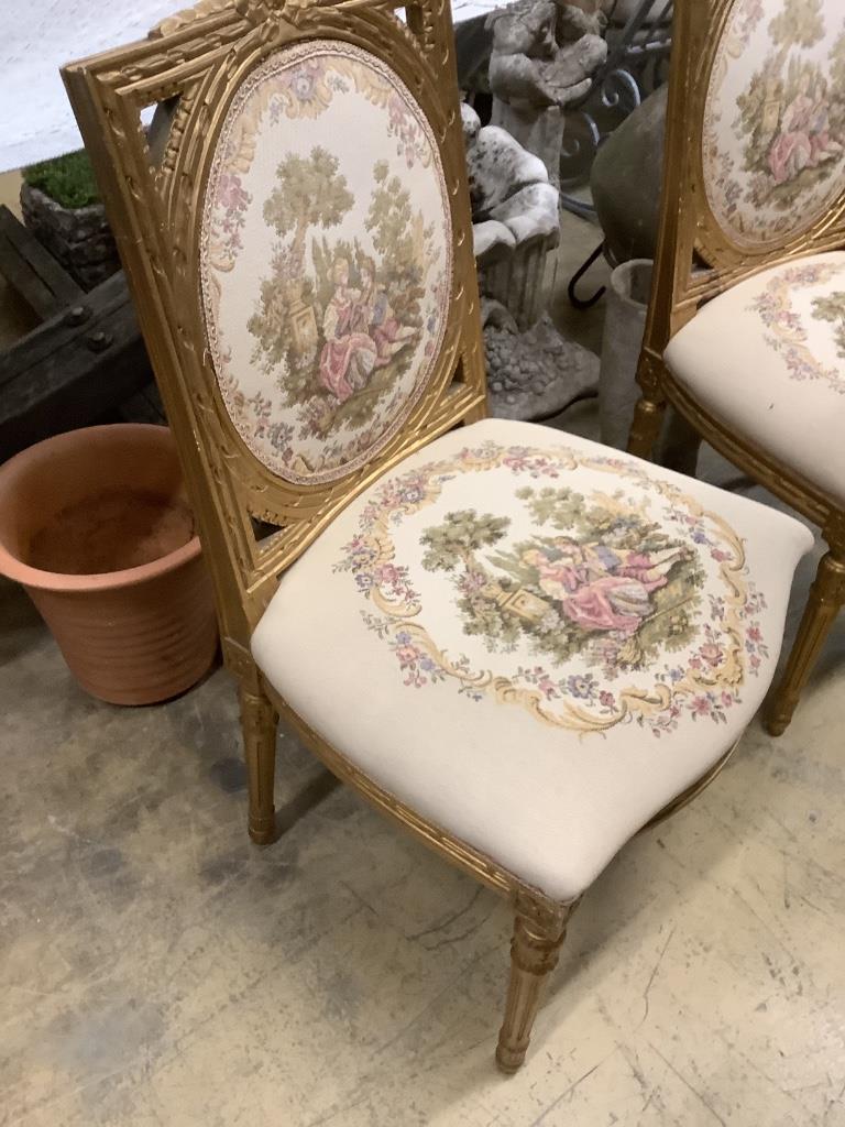 A set of six French giltwood and gesso tapestry back chairs (two with arms)